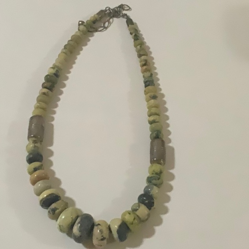 This is a 17 inch green speckled necklace